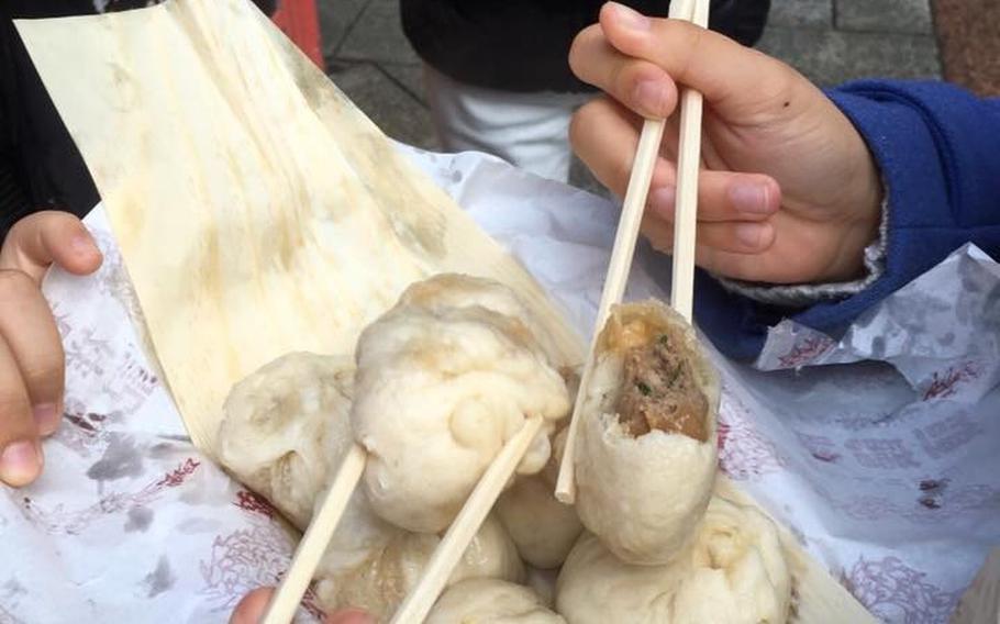 The outside of Roshoki's famous pork buns is fluffy and sweet, while the inside is perfectly seasoned and juicy.
