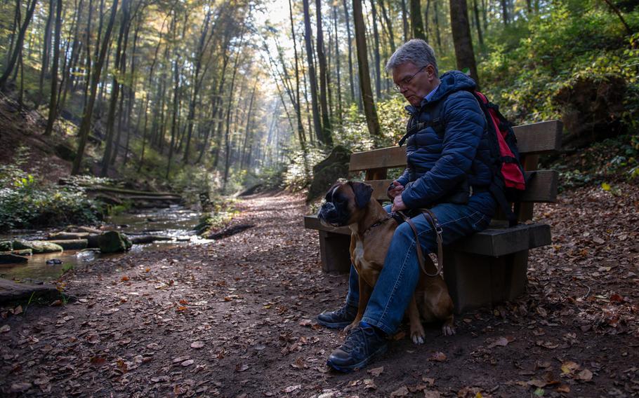 Kraus Walker and his dog, Cindy, take a break on the Karlstalschlucht trail, Oct. 10, 2018.