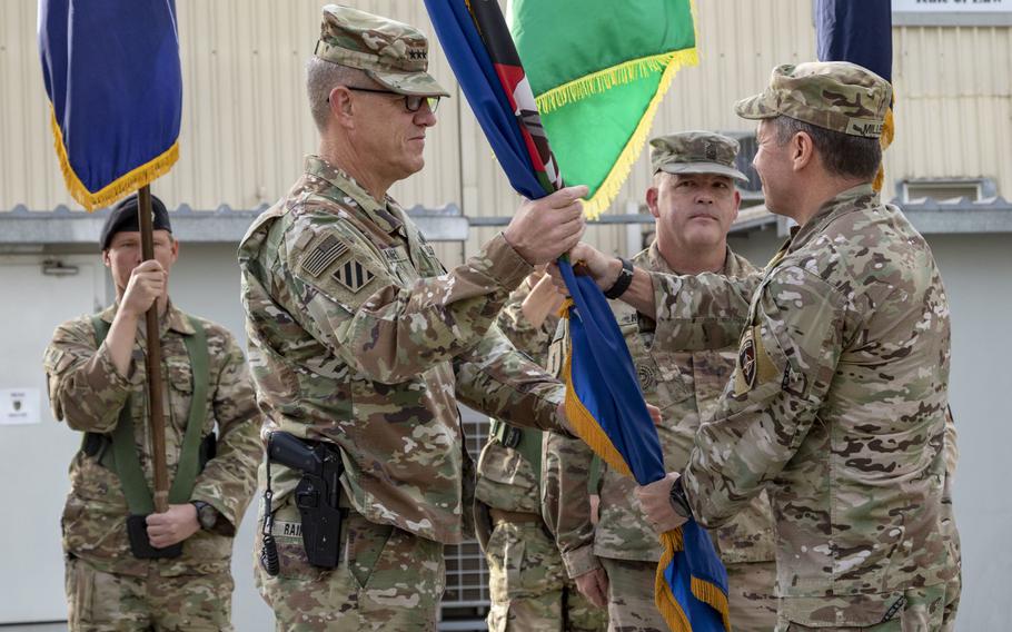 U.S. Army Lt. Gen. James Rainey, left, receives the Combined Security Transition Command - Afghanistan guidon from U.S. Army Gen. Scott Miller, commander, Resolute Support. Rainey assumed command of CSTC-A during a change of command ceremony today in Kabul, Afghanistan.
