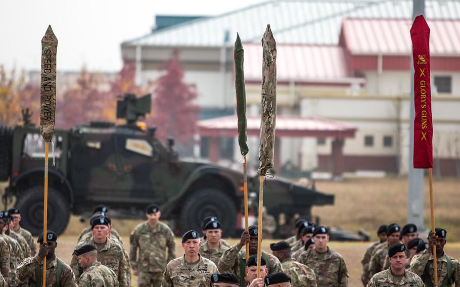 The 1st Armored Brigade, 3rd Infantry Division colors are cased during a transfer of authority ceremony at Camp Humphreys, South Korea, Monday, Oct. 22, 2018.