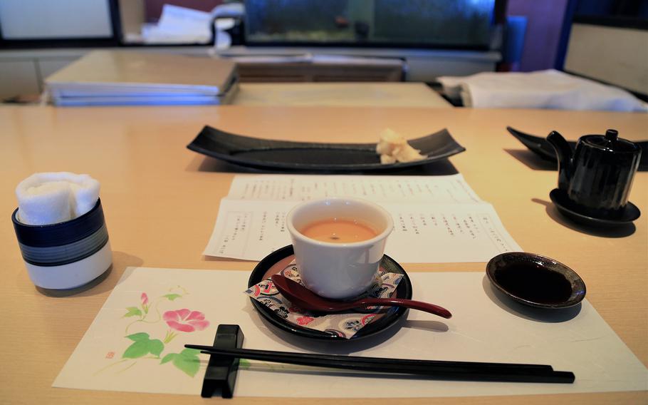 Sitting at the counter inside Waryu Sushi Shuna allows customers to order directly from the sushi chef. The restaurant's set meals include chawan mushi, a fish-based broth with steamed egg curd.