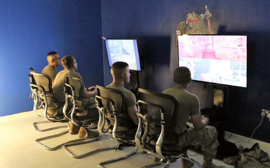 Servicemembers playing video games at the remodeled USO Camp Arifjan, Kuwait December 17, 2017. 
