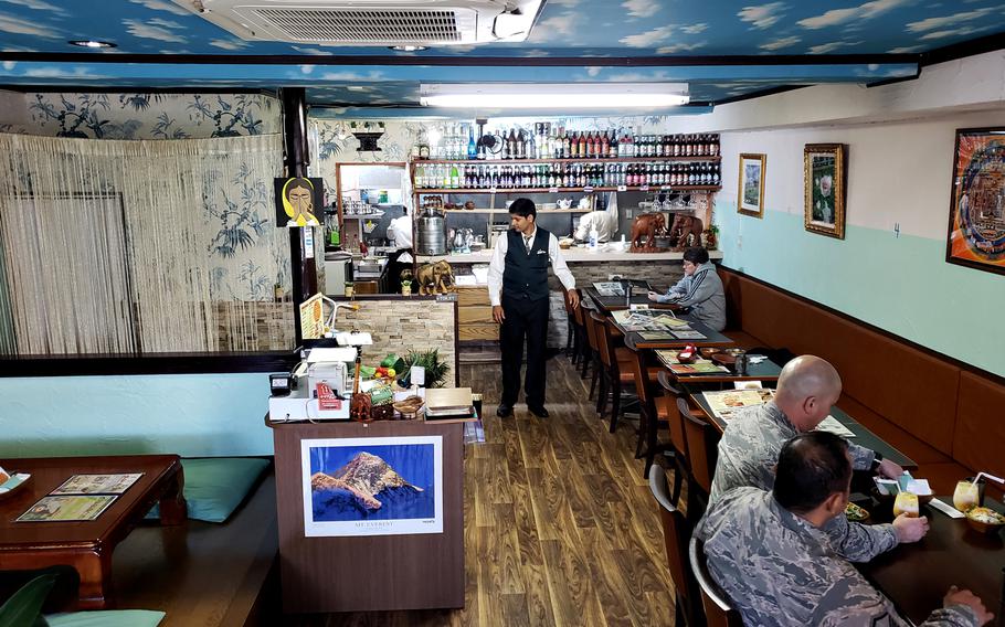 Kharel Krishna, owner of Dana Chula Family Indian Restaurant near Yokota Air Base in western Tokyo, waits on customers November 8, 2018 before the lunch rush begins.