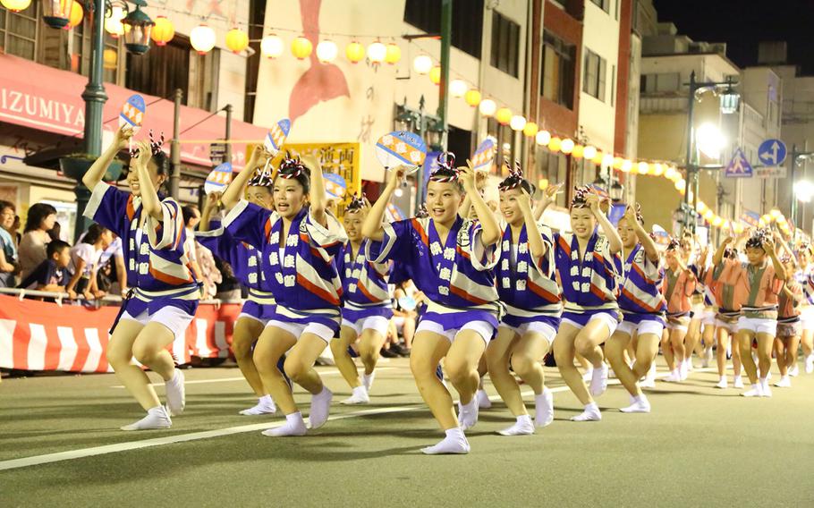 Dancers perform during Awa Odori in Tokushima. The event is the premiere event for the region during the Obon season in Japan.