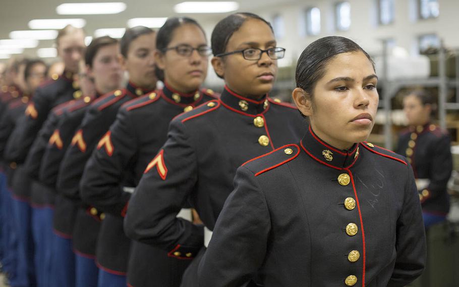 Marines with November Company, 4th Recruit Training Battalion wait to have their uniforms examined by fitters at Marine Corps Recruit Depot Parris Island, S.C., Nov. 9, 2018.