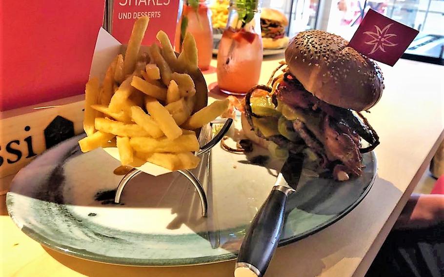 A massive burger known as the Karl de Grosse is served for lunch at Sissi und Franz restaurant in Kaiserslautern, Germany. The burgers start at just under eight euros apiece, a departure from the low-priced McDonald's the building formerly housed.