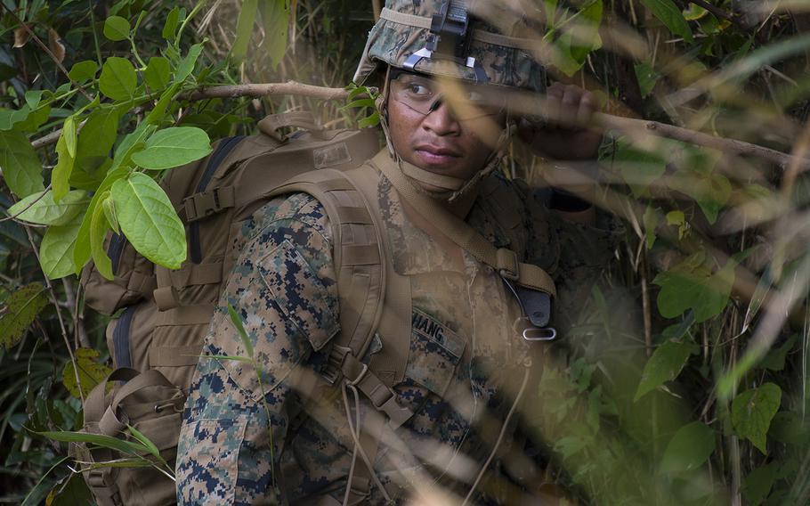 A Marine with the 9th Engineering Support Battalion takes part in a drill at the Jungle Warfare Training Center, Okinawa, Dec. 4, 2018.