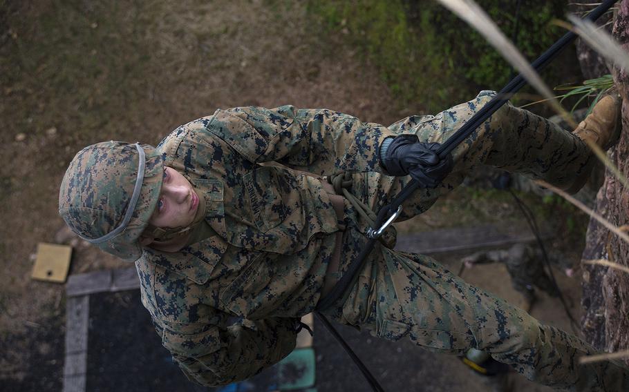 A Marine with the 9th Engineering Support Battalion rappels during an exercise at the Jungle Warfare Training Center, Okinawa, Dec. 4, 2018.