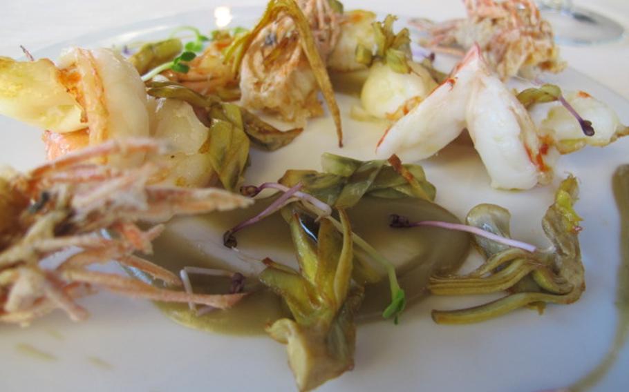 An appetizer at Massimo Gusto in Vicenza combined shrimp with crunchy fried prawns and artichoke.