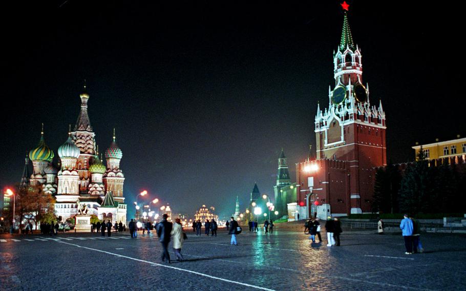 Tourists and Muscovites stroll across Red Square, with St. Basil's Cathedral on the left and the Kremlin with the Spassky tower at right.  U.S. European Command confirmed that a directive still stands that advises military personnel to refrain from all non-business travel to Russia unless it is for a family emergency.
