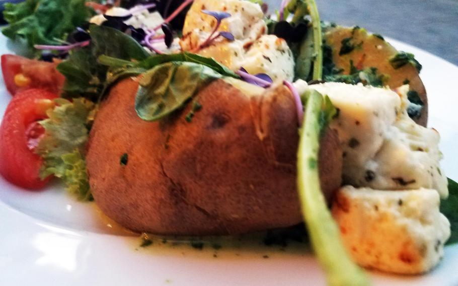 The baked potato with spinach at Oskar - Das Wirtshaus am Markt in Bayreuth, Germany, is a tasty vegetarian option at the restaurant, which also serves up hefty slabs of meat.