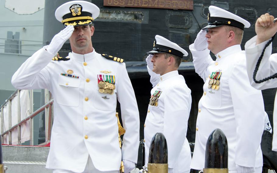 Capt. Travis Zettel, then-commander of the fast-attack submarine USS Bremerton, salutes sideboys at Joint Base Pearl Harbor-Hickam, Hawaii, Aug. 5, 2016.