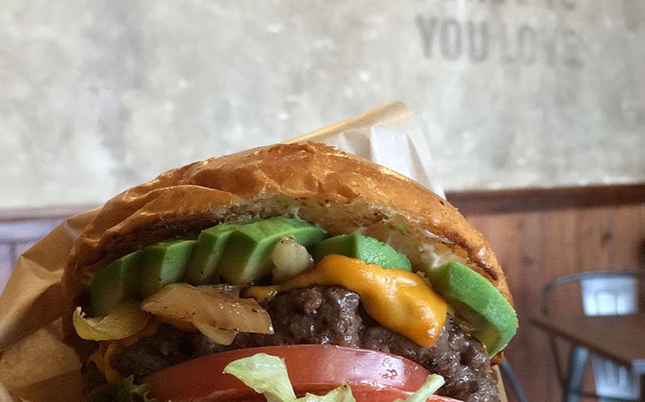The avocado cheeseburger at Ralph's Burger Restaurant is undeniably massive, and is topped with fresh lettuce, a thick-cut tomato, grilled onion and a generous serving of avocado.