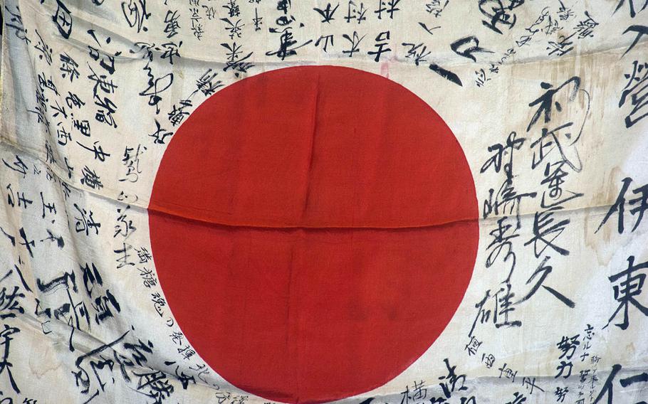 This signature-covered Japanese flag, taken as a war trophy during the Battle of Iwo Jima, was returned to the family of its former owner in Takasaki, Japan, Thursday, Feb. 14, 2019.