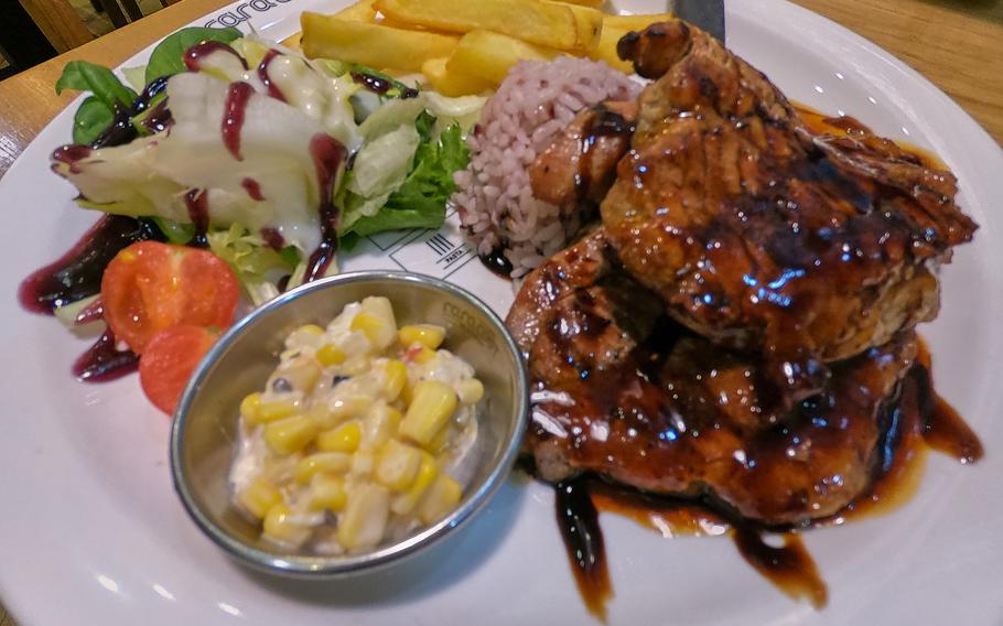 The Double Pork steak at Raracost (17,900 won, or about $16) is served with a sweet sauce, salad and fries.