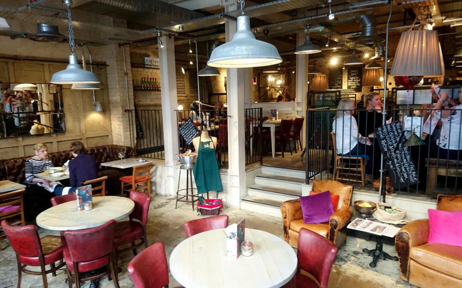 Part of the dining area inside the Bill's Restaurant in Bury St Edmunds, England, Feb. 26. The restaurant was previously a bank but now has an industrial interior design with distressed table and cushioned chair arrangements instead of a vault.