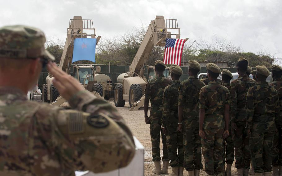 Somali national army soldiers stand in formation during a logistics course graduation ceremony in August 2018. Soldiers from Somalia's advanced infantry Danab battalion spent 14 weeks training with the U.S. 10th Mountain Division.