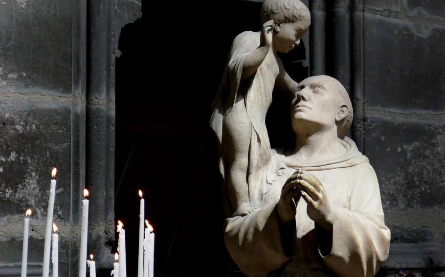 A statue of Saint Anthony of Padua in the Cathedral of Notre-Dame in Reims, France.