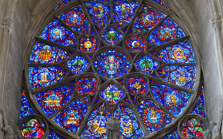 The beautiful stained-glass rose window above the western portal of the Cathedral of Notre-Dame in Reims, France.