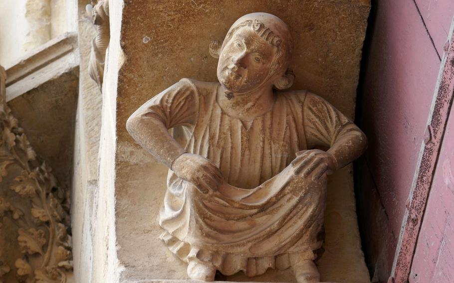 This fellow seems to be caring the weight of a Reims cathedral portal on his shoulders. Construction of the Cathedral of Notre-Dame began in 1221 to replace an earlier edifice that was destroyed by fire.