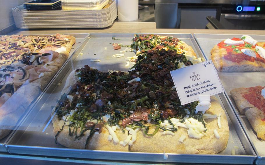 Fattore F in Vicenza, Italy, sells pizza to go priced by weight in addition to 16 pizzas on the menu. Pictured is pizza with mozzarella, radicchio, olives and broccoli fiolaro, a locally-grown type of broccoli.