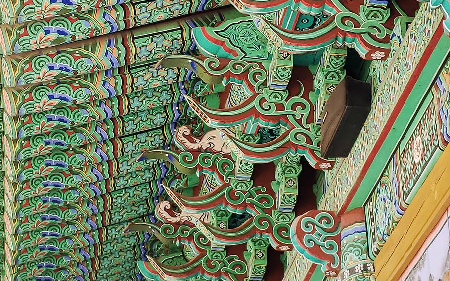 The exterior of Daeungjeon Hall at Mangisa Temple in Jinwi, South Korea is covered in intricate designs.