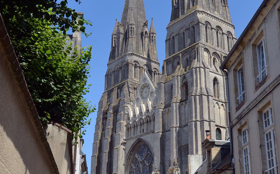 Notre Dame, Bayeux, France's 13th-century Gothic cathedral rises up over the streets of the city. Its crypt dates to the 11th century, but the copper dome is from the 19th century.