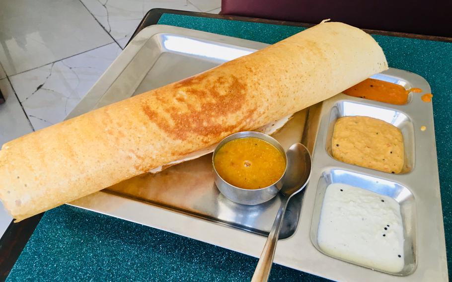 An Indian breakfast favorite called dosa, a crispy crepe-like specialty filled with potatoes or vegetables and served with with curry, can be found at Saravana Bhavan in Bahrain. Saravana Bhavan is an international chain serving southern Indian vegetarian cuisine.