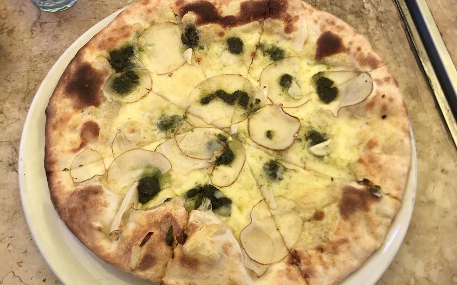 The Genovese pie at Pizzeria La Soffitta in Shibuya, Tokyo, has a soft, thin crust, about the right amount of cheese, sauce, garlic and potato.