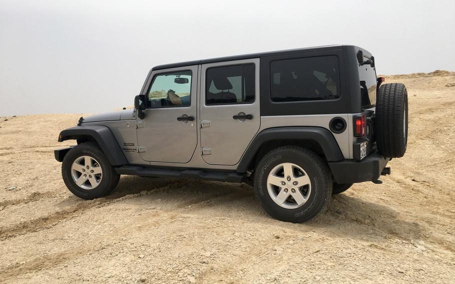 A 4X4 Jeep Wrangler navigates an off-road trail on a quiet day in the Southern Governate of Bahrain on May 11, 2019.