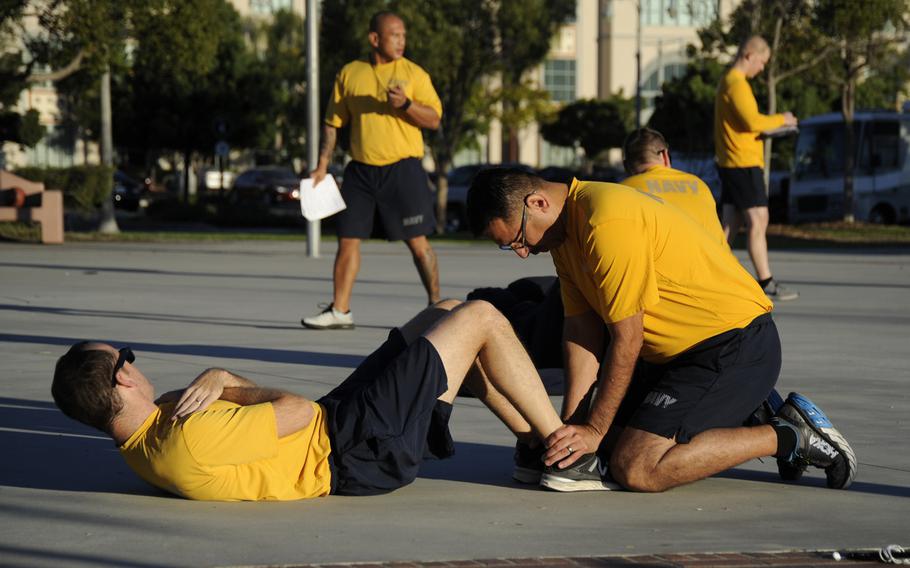 Sailors assigned to 3rd Fleet conduct a physical readiness test in November 2018. The Navy announced it will do away with situps for Navy PRTs, replacing them with a plank exercise.