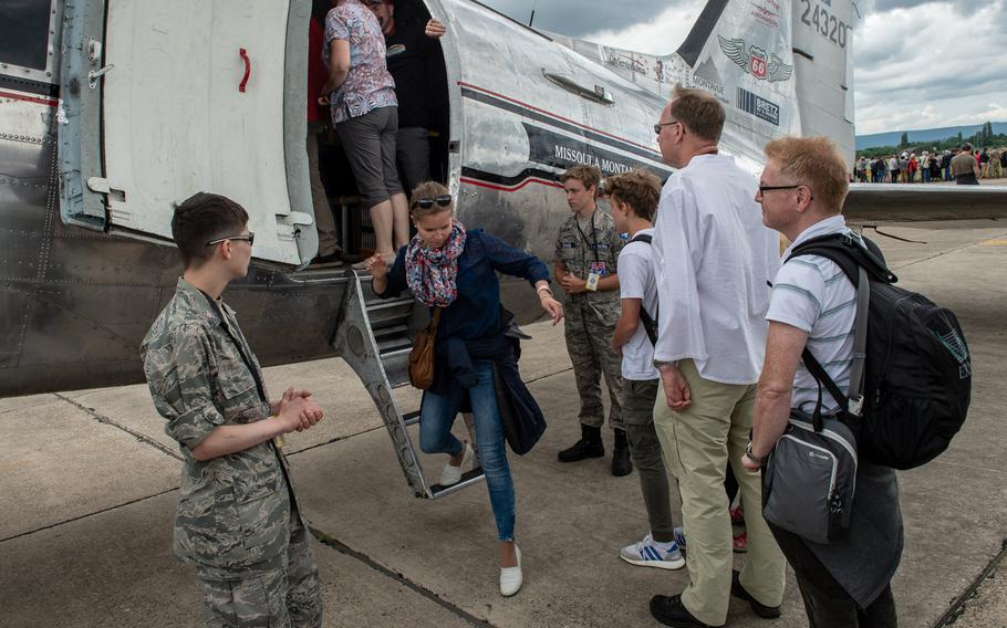 Spectators wait to board the C-47 known as Miss Montana as it sits on display during the 70th anniversary commemoration of the end of the Berlin Airlift at Clay Kaserne airfield, Monday, June 10, 2019. 