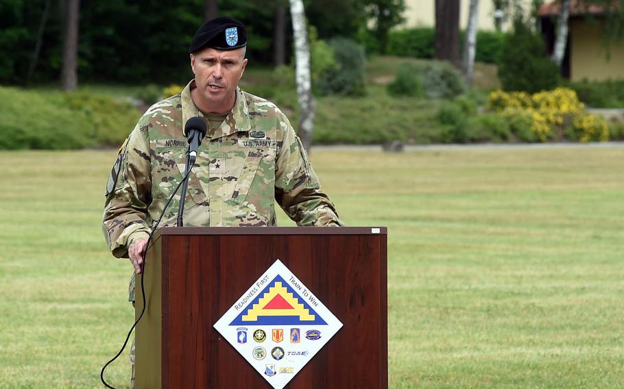 Brig. Gen. Christopher Norrie, the new commander of the 7th Army Training Command, speaks to the crowd at the change of command ceremony at Grafenwoehr, Germany, Tuesday, June 11, 2019.