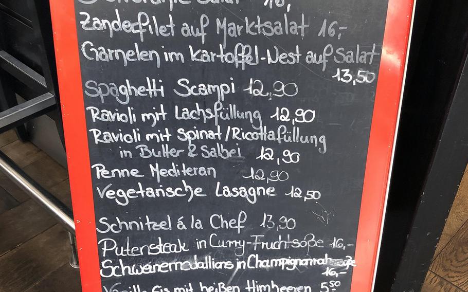 A chalk board inside Bistrorante Da Adriana in Kaiserslautern, Germany, features additional dishes not on the regular menu.