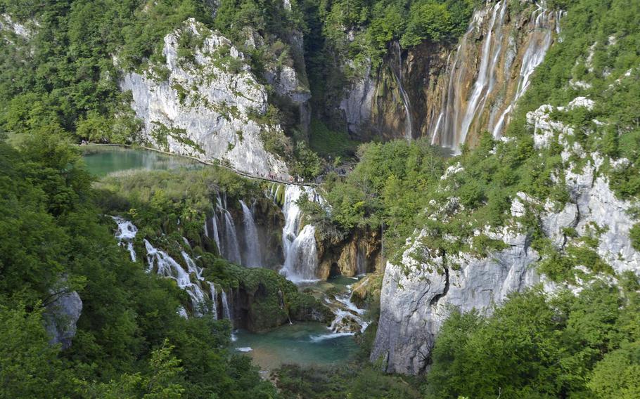 An upper lake surrounded by waterfalls is seen in Plitvice Lakes National Park in Croatia. The mountainous park, which is about 200 miles north of Aviano Air Base in Italy, offers visitors eight different routes to tour the lake system. 