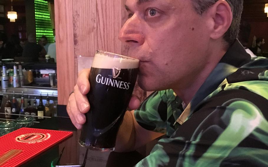 British pub fan Paul Phillips enjoys a pint of Guinness at McGettigan's, a new pub in Adliya, Bahrain, is a great place to enjoy the night in Bahrain, but not if you are looking for an authentic Irish pub vibe.