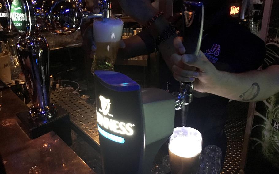 A pint of Guinness is poured at JJ's Irish Pub in Adliya, Bahrain.