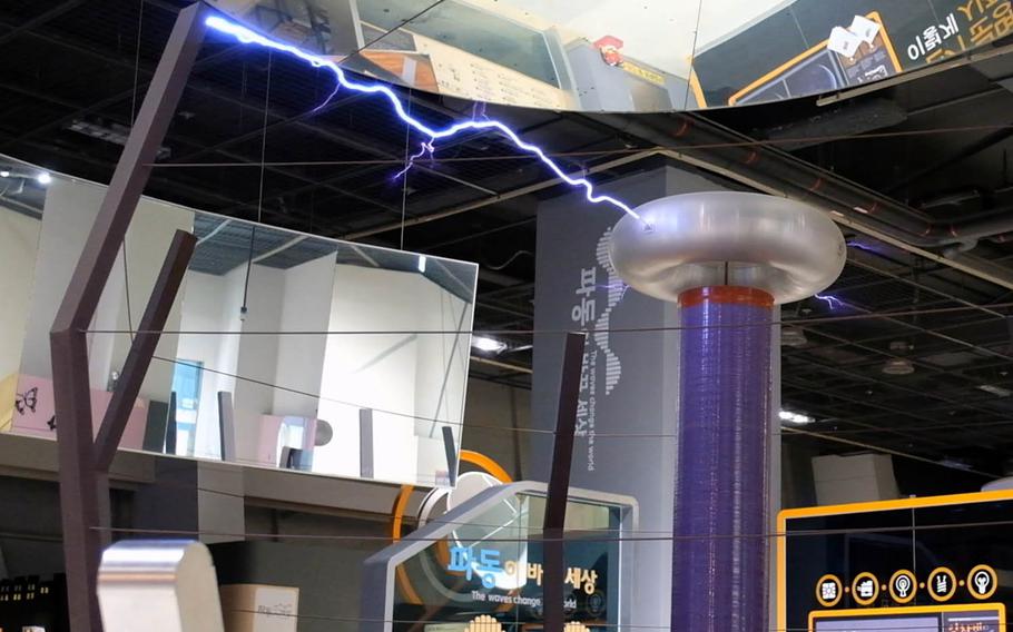 A Tesla coil discharges electrical energy to a metal grounding beam at the Gwacheon National Science Museum in Gwacheon, South Korea, on Tuesday, July 9, 2019.