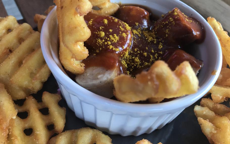 Currywurst served in a "stork's nest" of delightfully golden and crisp waffle fries is pictured here at Kaiserslautern's Storchenturm cafe-bistro-bar on Sunday, August 18, 2019.