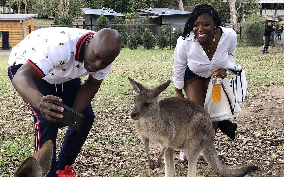 A couple takes a selfie with a kangaroo at Lone Pine Koala Sanctuary near Brisbane, Australia, July 7, 2019.