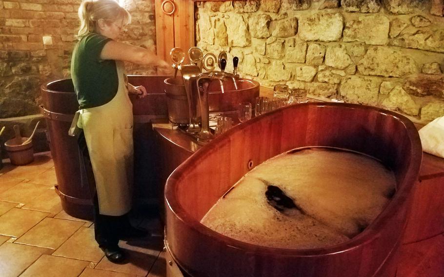A Spa Beerland Karlovy Vary employee prepares a beer tub for use, in Karlovy Vary, Czech Republic.