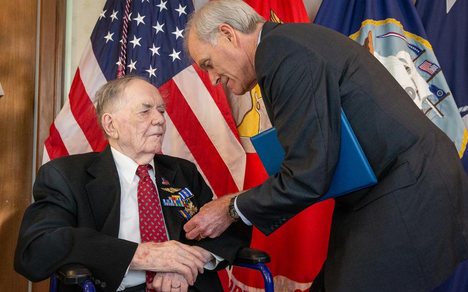 Secretary of the Navy Richard V. Spencer, right, awards retired aviation machinist mate 1st class Bernard B. Bartusiak, 95, with two Distinguished Flying Cross medals and the Air Medal, at a ceremony at the Pentagon on Tuesday, Sept. 10, 2019. Bartusiak earned the awards for dozens of missions he flew as part of a bomber crew during World War II, but "for reasons unknown," never received them until three-quarters of a century later.