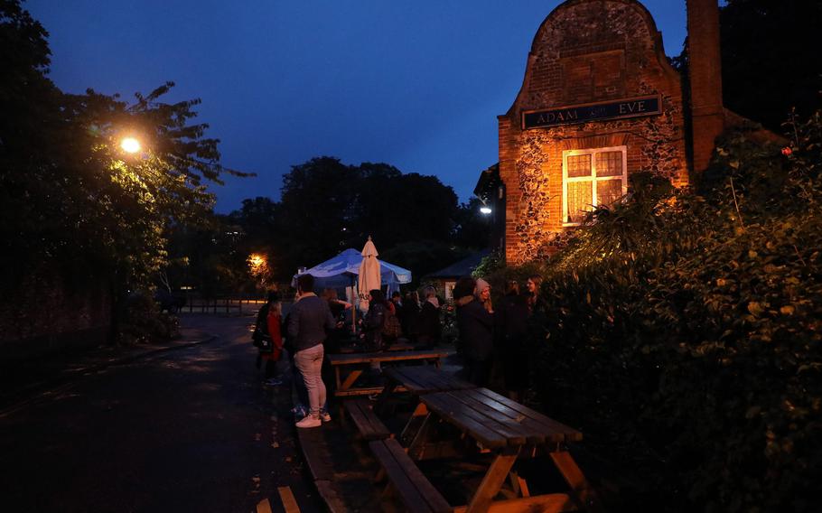 People gather in front of the Adam and Eve pub in Norwich before the Norwich Ghost Walk Tour on Sept. 24, 2019.