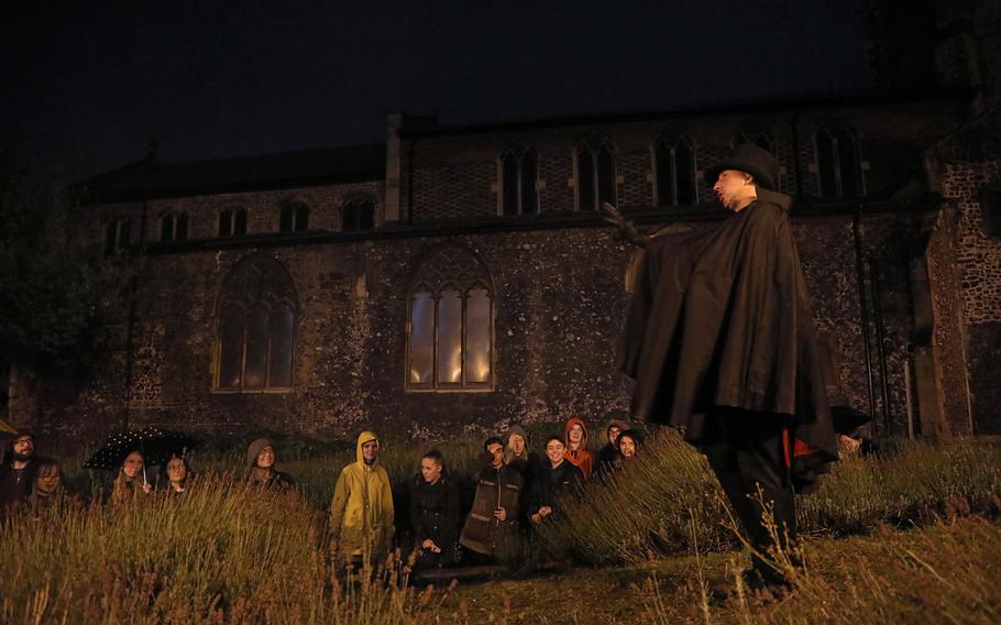 Le Morte describes what happened when the plague raked through Norwich in the 16th century, during a Norwich Ghost Walk Tour in the Tomb Alley area of Norwich, Sept. 24, 2019.
