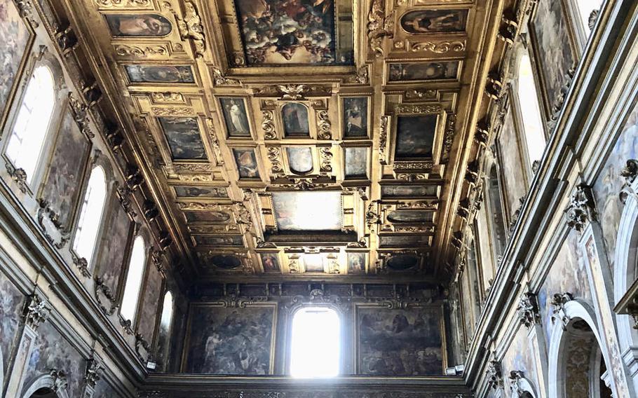 A gilded, muraled ceiling is one of the artistic marvels that can be seen at the Church of Santa Maria la Nova in Naples, Italy.