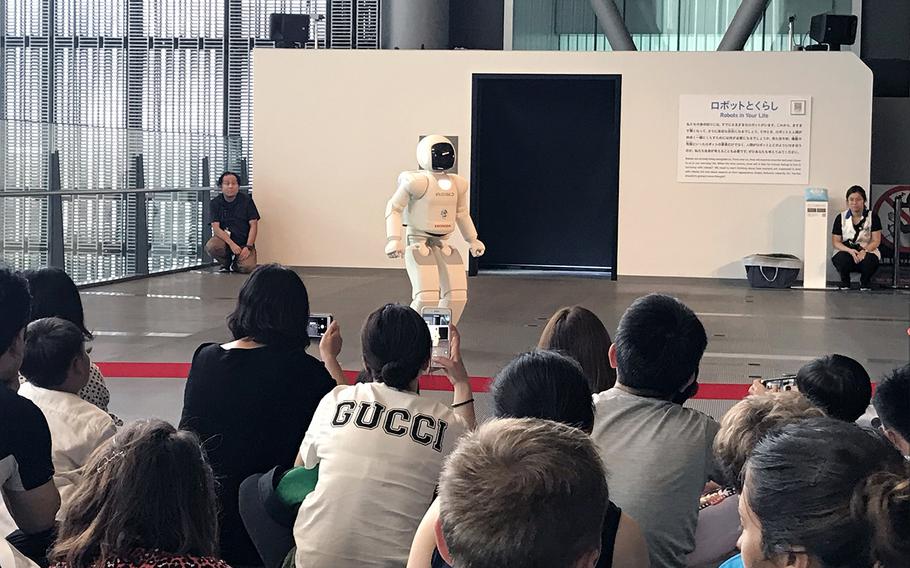 A humanoid robot named ASIMO kicks a ball and dances during presentations held four times a day at the National Museum of Emerging Science and Innovation, also known as the Miraikan, in Tokyo.