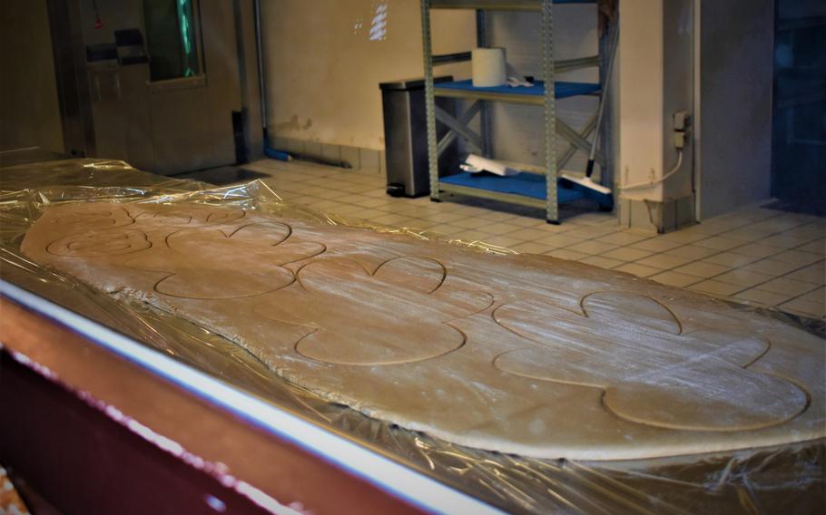 The factory tour at Le Palais du Pain d'Epices in Gertwiller, France, offers a window into the production of gingerbread, a key component of an authentic Alsatian Christmas.