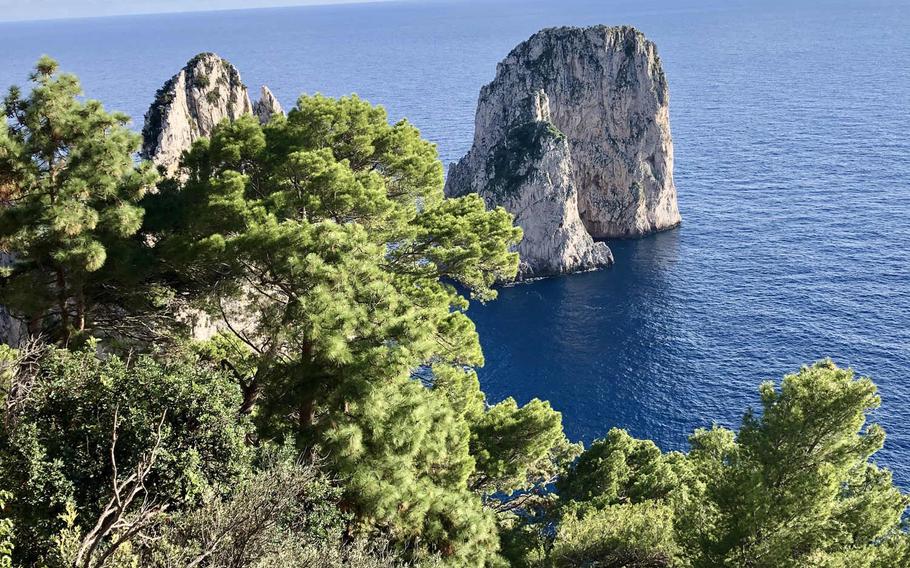 Capri's iconic Faraglioni rocks as seen from Hotel Punta Tragara's scenic overlook.