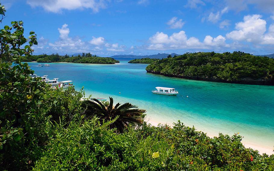 Kabira Bay on Ishigaki Island, Japan, is famous for its beautiful white sand beaches and turquoise waters. Visitors can go there on a glass-bottom boat.