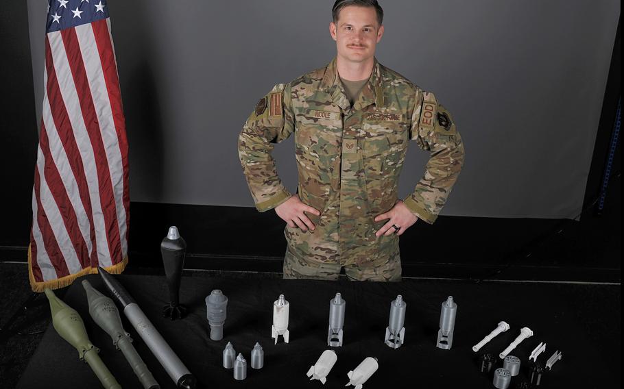 Staff Sgt. William Riddle, a 48th Civil Engineer Squadron Explosive Ordnance Disposal NCO, displays EOD training aids he printed from a 3D printer at RAF Lakenheath, England, Nov. 19, 2019. The 3D printer allows training aids to be produced for a fraction of the normal cost.
